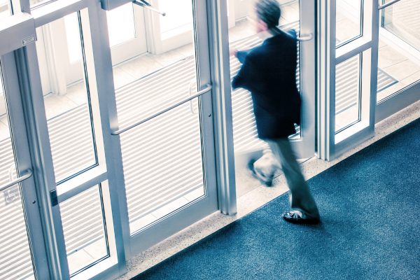 Man walking out of a business office